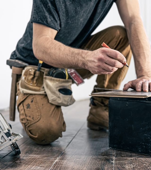 circular saw, carpenter using a circular saw for wood.
